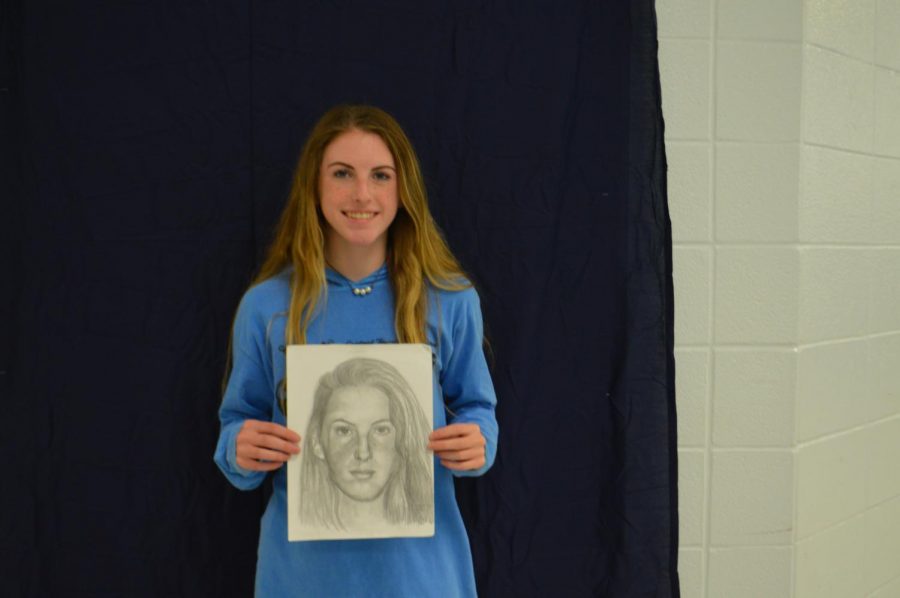 , Maddie Ford with her portrait.