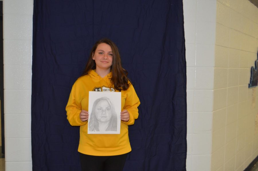 Sophomore, Sierra Bosse with her portrait.