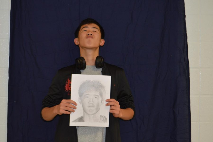 Junior, Taichi Karikomi with his portrait.