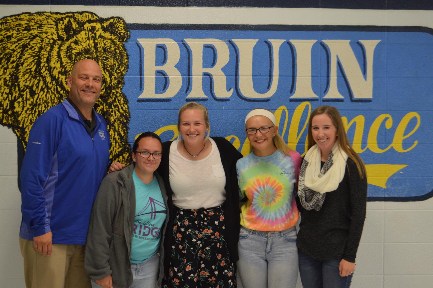 Isaacs, with the winners of his challenge: Bridget Denning, Laine Gaddie, Tori Mayes, and Kayla Slaubaugh