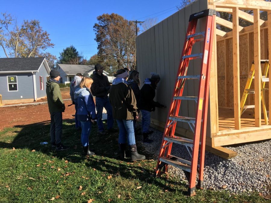 Junior Beta Members help build shed. 