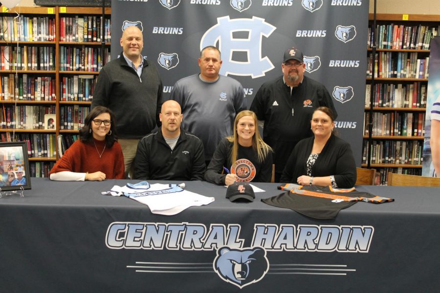 Peyton Beger signs with Georgetown College Softball on Nov. 28, surrounded by Jordin and Andy Beger (left) and Lori Beger (right). Back row: principal Tim Isaacs, CHHS coach Jamie Goodman, and Georgetown coach Thomas Thornton.