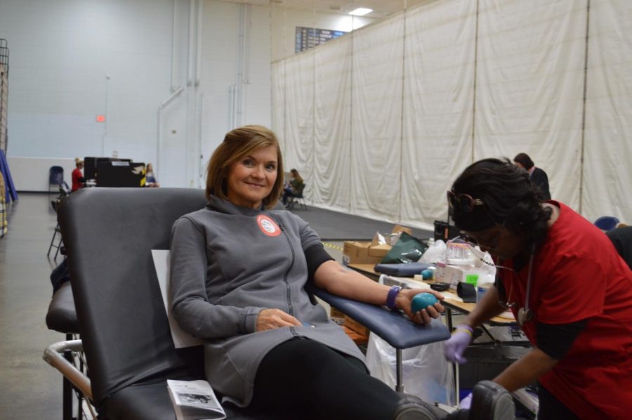 Junior counselor Kim Cardin donates blood at the winter blood drive. 