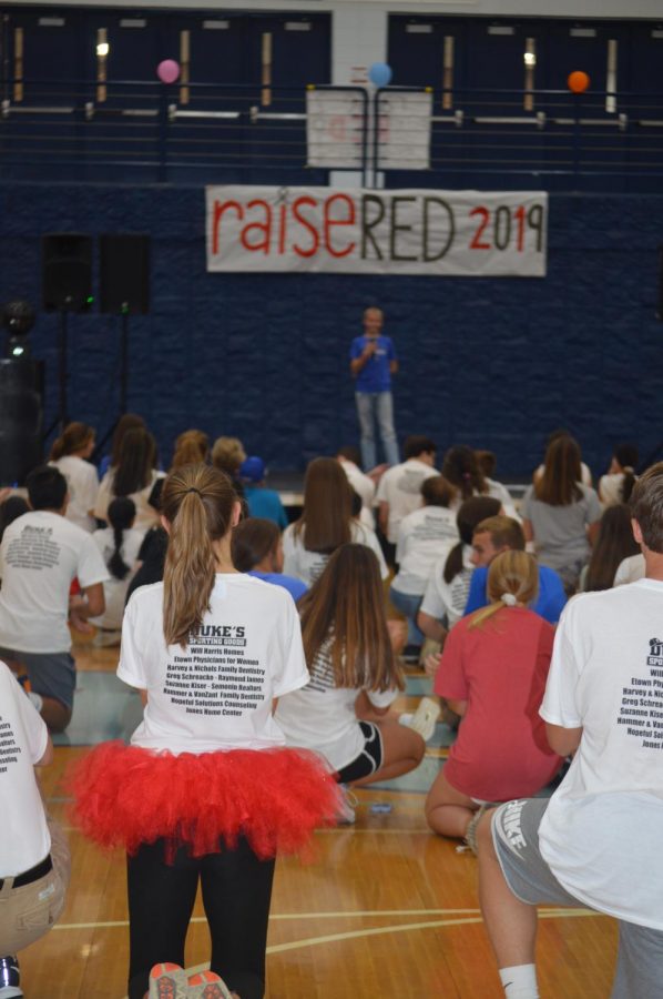 Participants listen attentively to freshman Eli Thompson describe his journey with cancer.