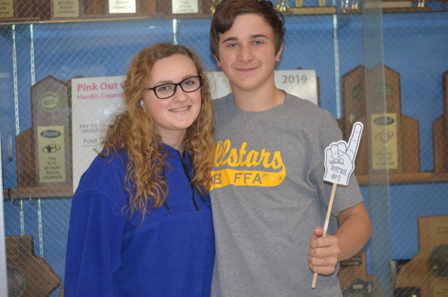 Junior Ivoree Sullenbarger poses with freshman Hunter Yates, who is her cousin, at the FCCLA photo booth on Feb. 14.