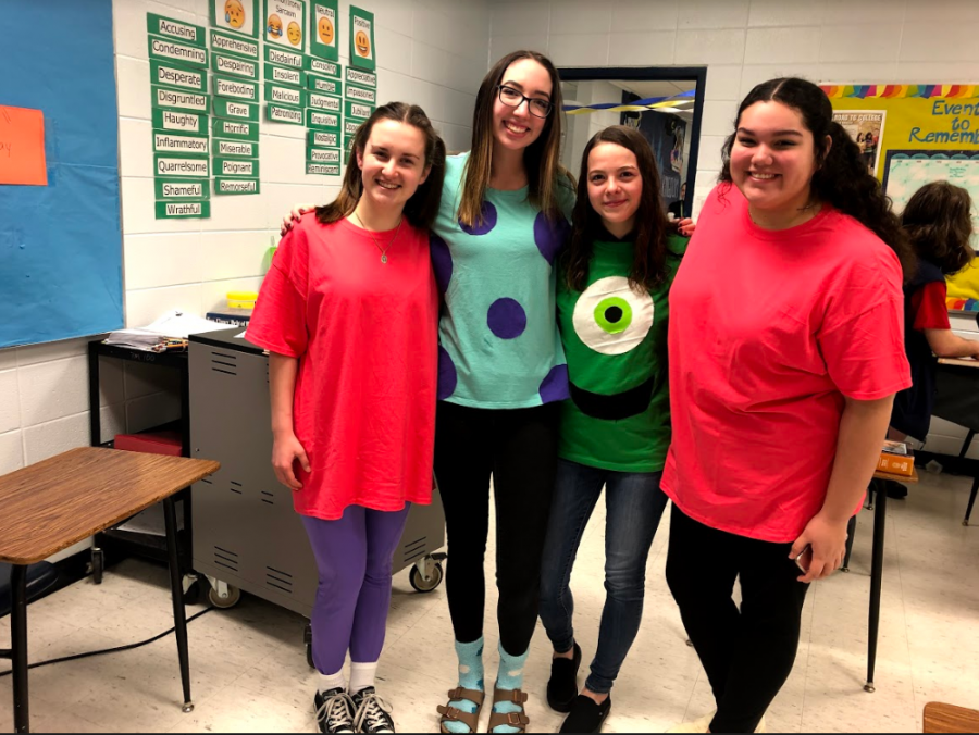 Students pose as Monsters Inc. characters.