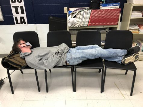 Senior Trevor Hardy lies down during the last five minutes of 2nd block after a tiring week and a half of five day instruction. ( April 21)