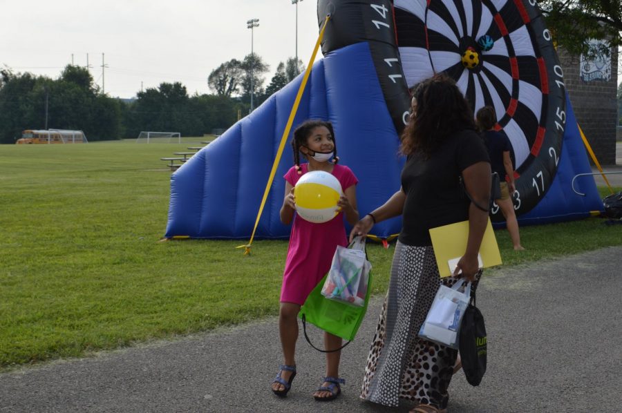 G.C. Burkhead student Yasmeen Esmail leaves the Bruin Fest on July 22 at Central Hardin High School with her mother, Cynthia Esmail, after winning a prize at the Bulls Eye game. 
The Esmail family moved to the area last year, so this was their first time attending a community event.