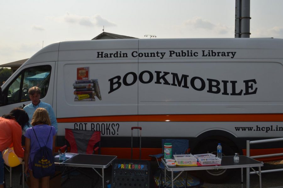 An associate from the Hardin County Public Library Bookmobile shares information with visitors at the Bruin Fest on July 22 at Central Hardin High School.