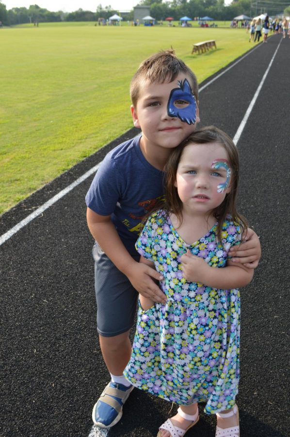 Six-year-old Lakewood first grader Mason Peters, who will be seven in August, shows off his face painting with three-year-old sister Maggie Peters at the Bruin Fest on July 22 at Central Hardin High School.