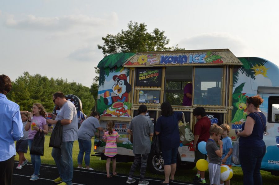 Participants wait in line for Kona Ice at the Bruin Fest on July 22 at Central Hardin High School.