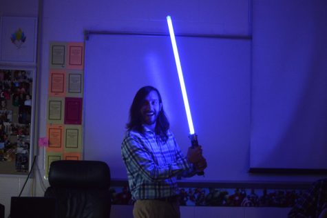 Civics teacher Brandon Mudd frolics the halls of Central Hardin, lightsaber in hand without a care in the world (Nov.11)