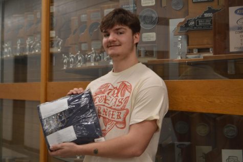 Senior Eli Stearman With His Cap and Gown