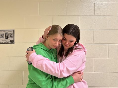 Sophomore Jayden Wyatt and junior Avery Prater embrace in a comforting hug 
