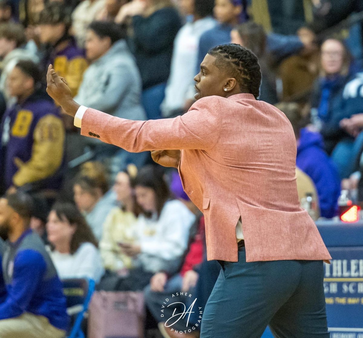 Health and PE teacher and assistant coach for the Boys Basketball team, Jordan Cooper-Livers, in action coaching; Courtesy of Jordan Cooper-Livers