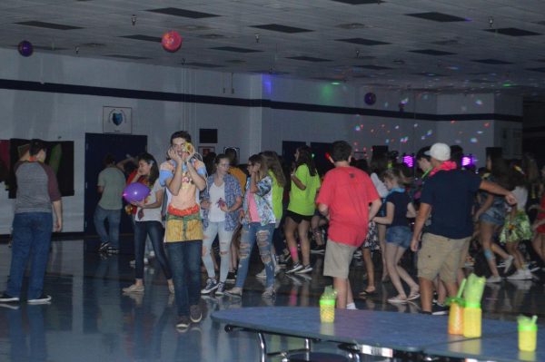 The football homecoming dance from 2018, hosted by Y-Club, was well attended with a neon theme.