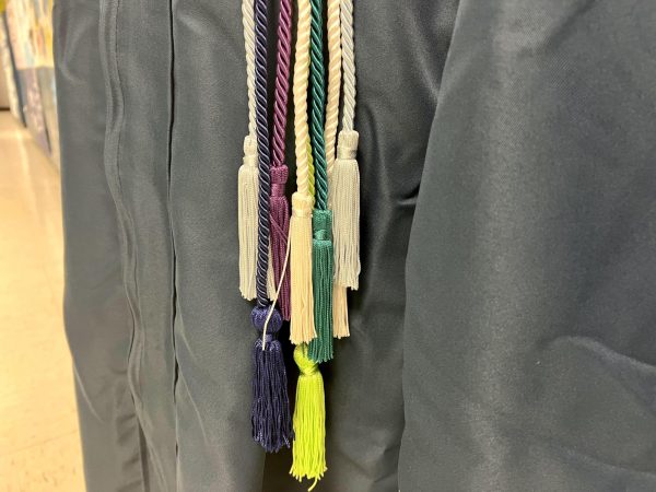 Various graduation cords displayed against the CHHS graduation gown (Sept. 8).