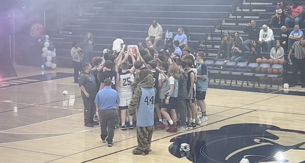 The Central Hardin boys basketball team breaking out as a team after the Ballin With The Bruins showcase night (Nov. 14).