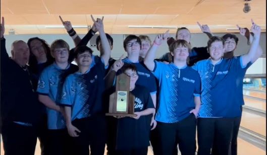 The boys bowling team celebrates after winning Region last week. This is the first year that the boys and girls teams have won Region in the same year.  The teams are competing at State this week.