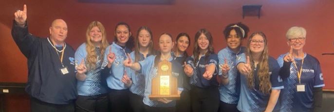 The girls bowling team celebrates after winning Region last week. This is the first year that the boys and girls teams have won Region in the same year. The teams are competing at State this week.