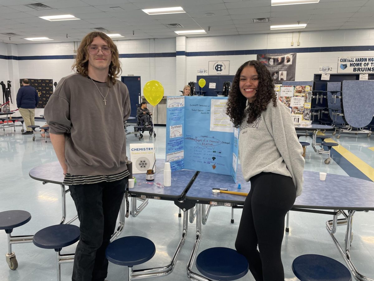Junior Zain Lowery (left) and junior Selest Sutton (right) are all smiles after successfully performing their chemical reactions for Parent Night. The two showcased their Chemistry course. (Mar 21)