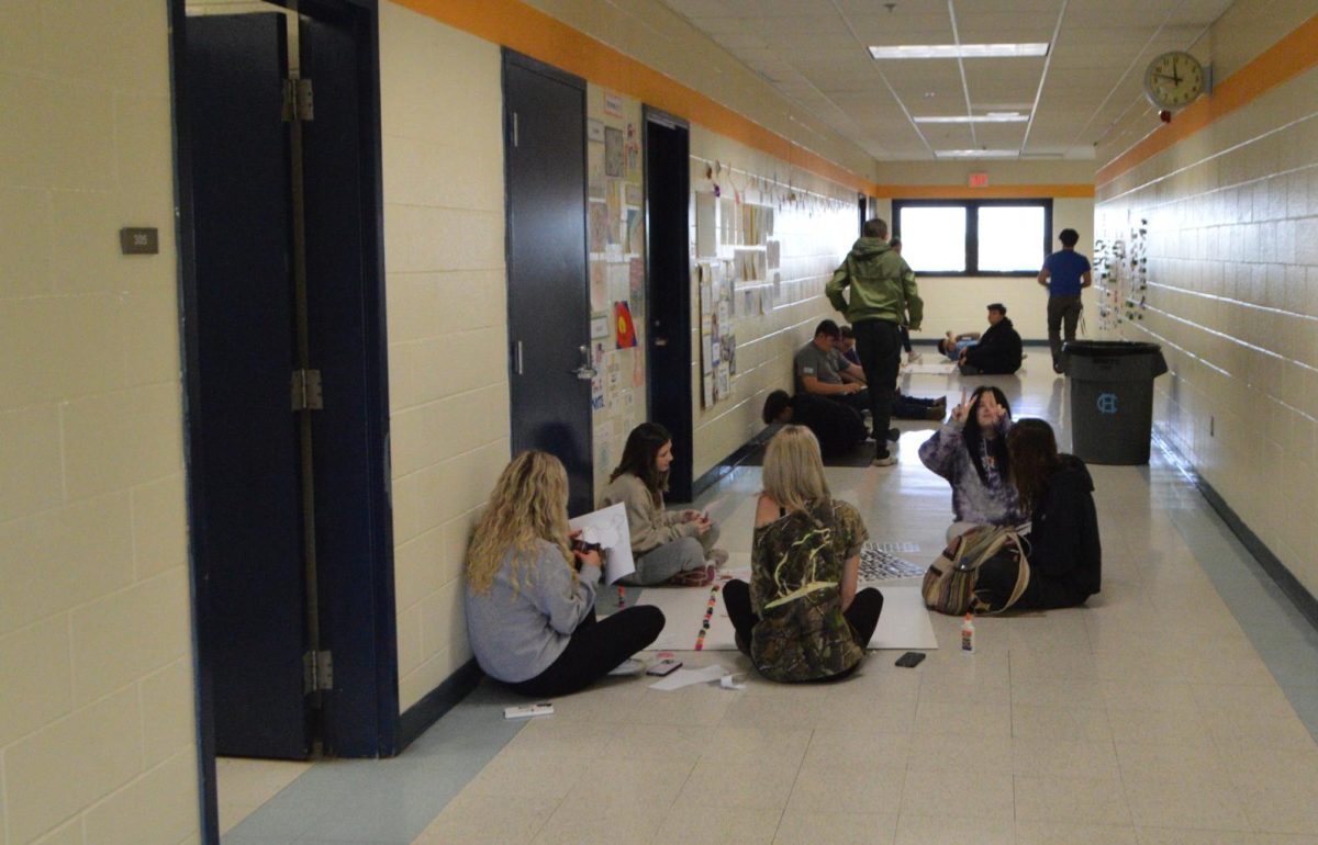 Mr. Vanmeters third period Arts and Humanities class works on their group projects in the 300s hallway. (Apr. 25)