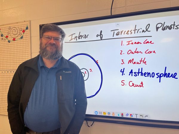 Science and Math teacher Charles Pearsall, teaching his astronomy class about terrestrial planets. Photo courtesy of Lindy Barnes