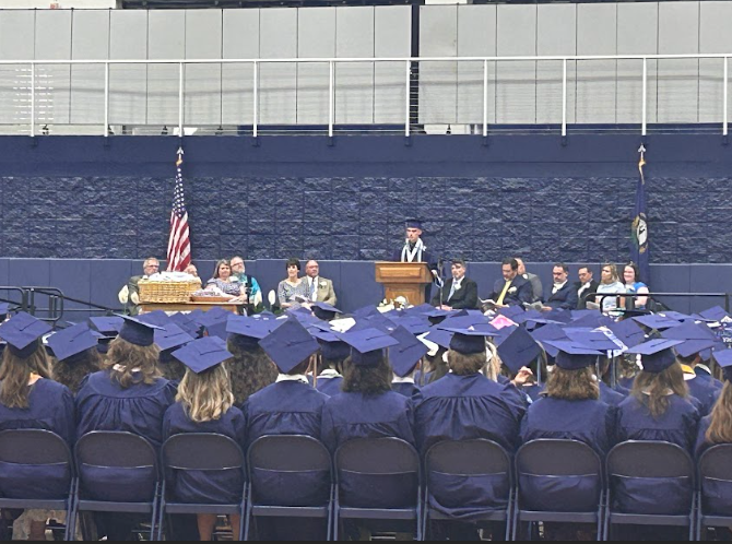 Class of 2024 president Ethan Williams delivers his commencement speech to his peers on May 25. See the cap toss and fight song in action in the video below.