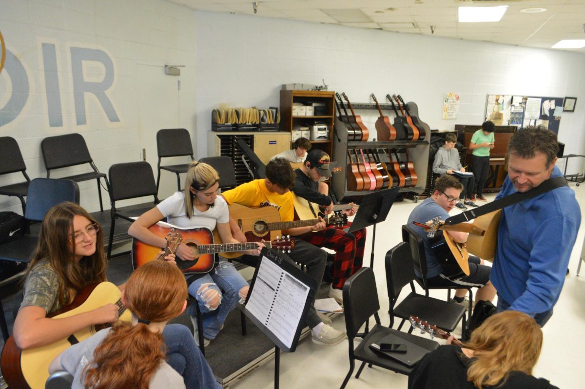 Brandon Centers teaching his 3d block guitar class. (Aug. 30) Along with guitar, he teaches Arts and Humanities and Choir.