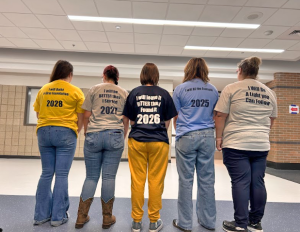 Freshman Josie Eskridge, sophomore Sherry Fornash, junior Dixie Haynes, senior Lainey Risley, and assistant principal Emily Wortham model their new "2 Sites, 1 House, 1 Family shirts on Sept. 13. The shirts were purchased for each student and faculty member and display the messages, "I will build a firm foundation," "I will be better than I started," "I will leave it better than I found it," "I will be the example," and "I will be a light you can follow." 