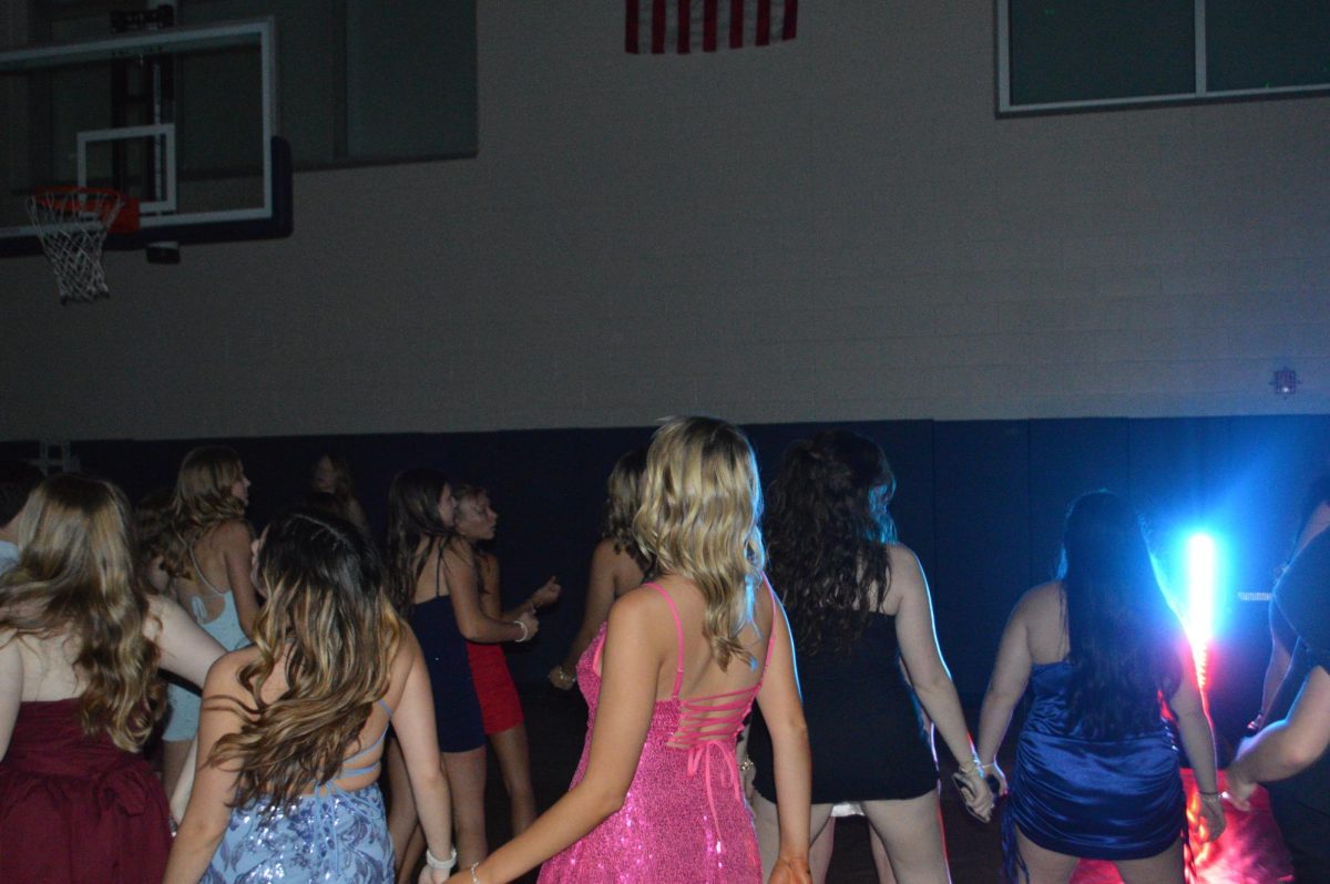 Students dance the night away while enjoying the homecoming dance on Oct.26. The Homecoming dance was a long awaited event to come back after 5 years. Over 300 people applied for a ticket to the dance and was a total success.