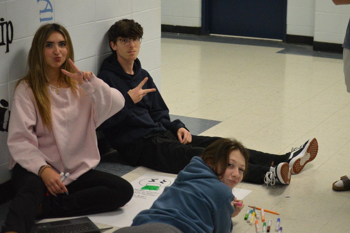 Rachel Wilson's psychology class makes poster about different forms of addictions. This group, Seniors Celia Keith, Walker Lyvers, and Junior Josie Burkhead are working on one about alcoholism. (Dec. 10)