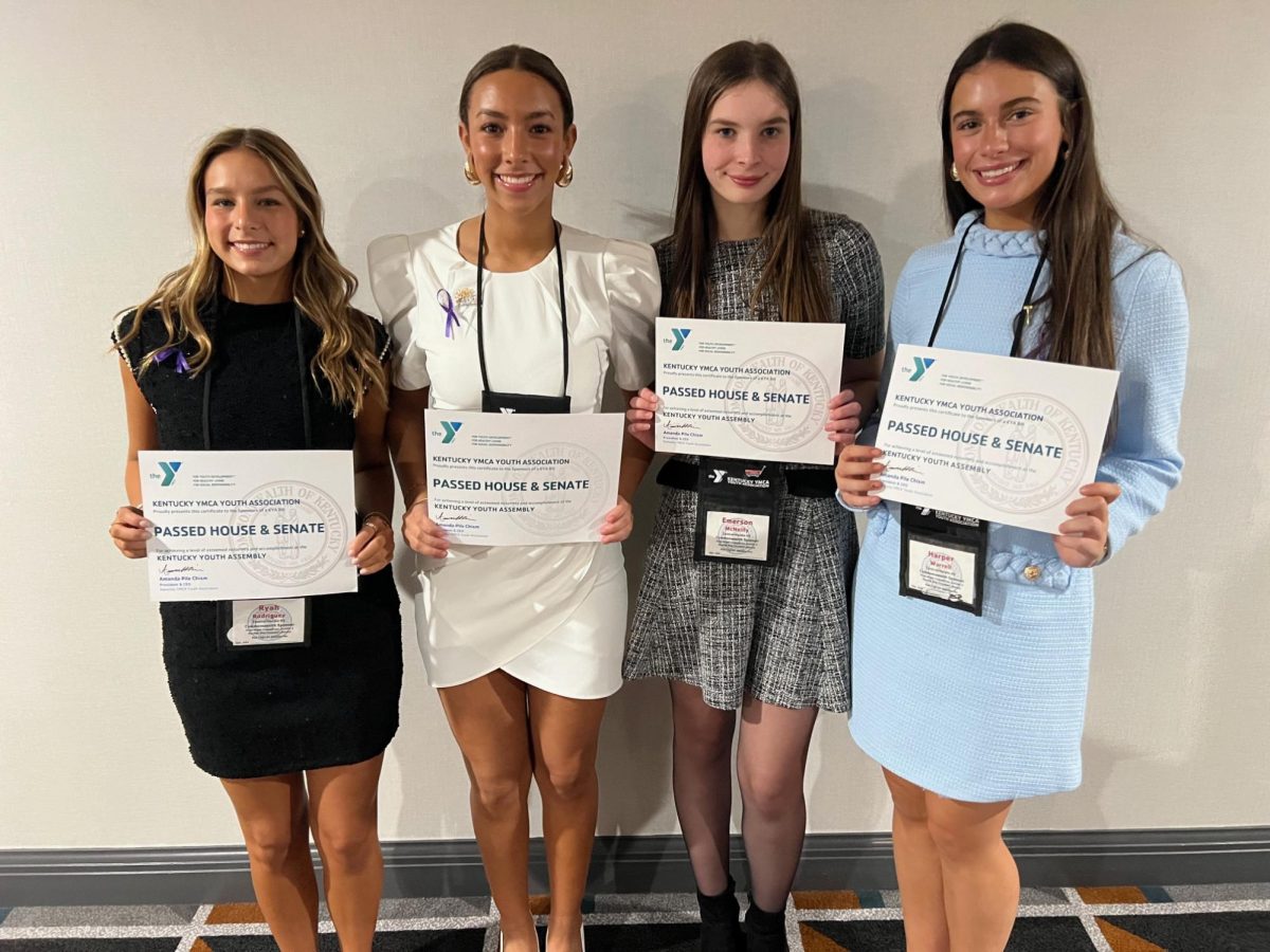 Seniors Ryah Rodriguez, Jenaya Adams, Emerson McNeilly and Harper Warrell stand with their awards at KYA on Nov. 26. "It was definitely the most memorable way to end my time with KYA," Warrell said.