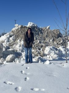 Junior Emma Smith  was compared to the height of a snow pile in the school parking lot. (Jan.13)