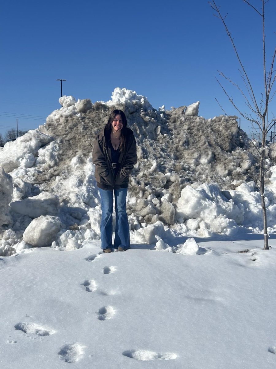 Junior Emma Smith  was compared to the height of a snow pile in the school parking lot. (Jan.13)