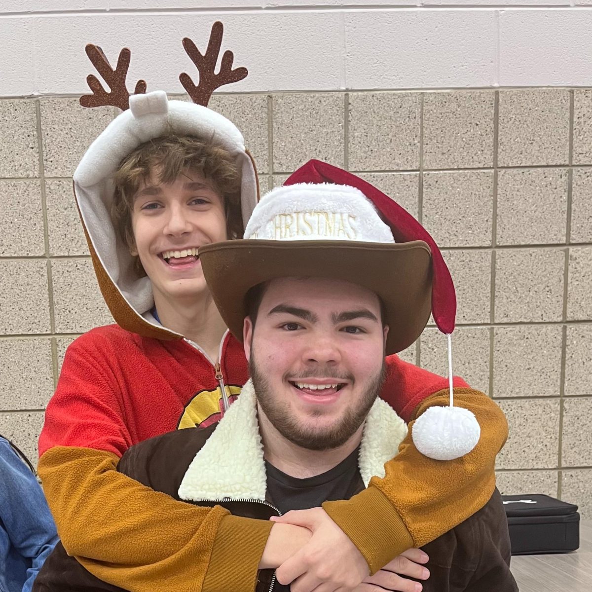 Sophomores Eli Edmiston and Parker Clark share a holiday hug during lunch on Dec. 19. 