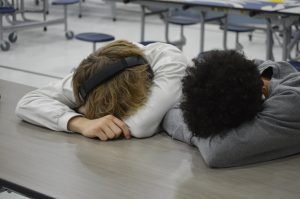 Junior students Brian Cox and Tristen Shrouder catching up on sleep during study hall after the time change Mar. 10. 