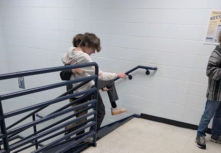 Junior Trente Lyvers and sophomore Eli Edmiston carry each other up the stairs when helping with the horror short film for Kayla Honaker's class. They said "If we aren't getting killed then we are out of here." (Feb. 18)