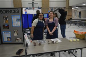 Sophomore Sabrina Aldridge and junior Jazmine Carpenter are giving out ice cream to families at Central Celebrates. The ice cream was made in Leslie Lewis' advanced foods class. (March 20)