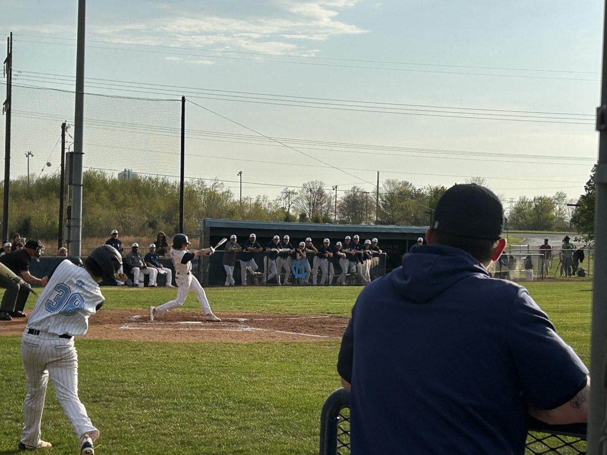 April 18th, Central Hardin Baseball kicks off the weekend against Etown at Central. Senior Reece Cowley, jersey number 2, is at bat.