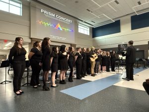 The choir performs in the Prism Concert on May 6. The concert featured art of all forms from the Graphic Design, art, and band classes at Central. (Courtesy of Noah Centers). 