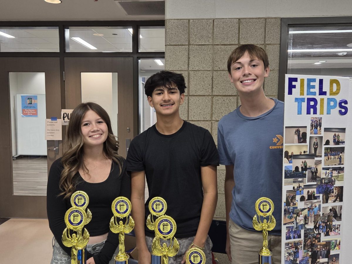 Juniors Alexander Cabral (M) and Aryah Clark (L), and sophomore Rhett Edlin (R) promote the Future Business Leaders of America at Central Hardin's Club Bash on August 21st.
