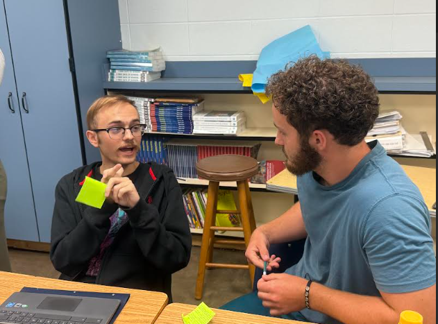 Seniors Carter White and Tristan Adams converse during a PBL protocol in Emily Wortham's DC education class. The protocol involved students informing others about a learning style they were assigned. (Aug. 14) 