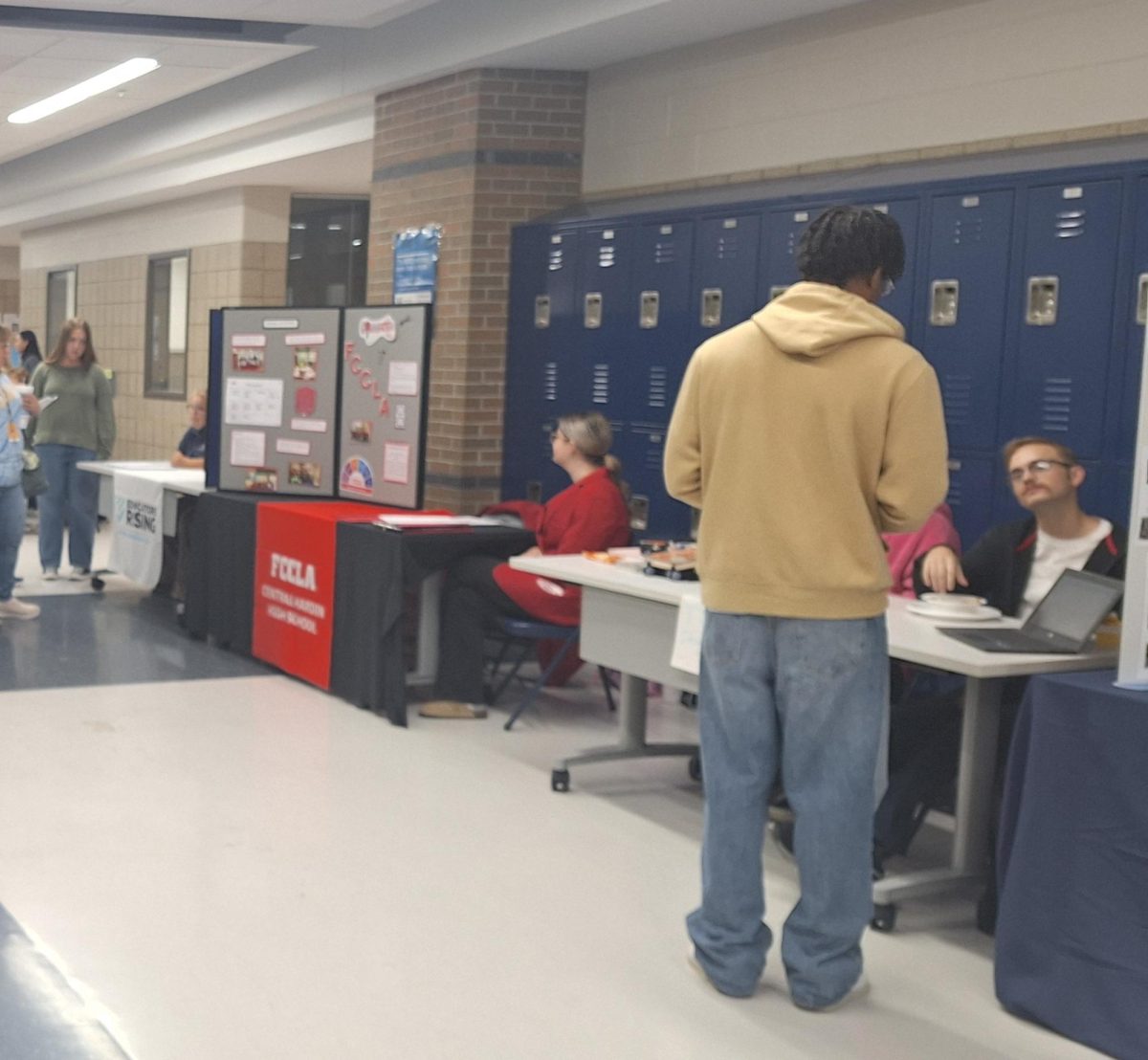 Senior Kenny Smith talks to senior Carter White about TSA Design Club during Club Rush. 
