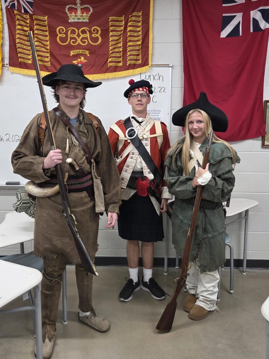 (From left to right) Juniors Alex Meredith, Owen Cunningham, and Aniston Ruley stand dressed in colonial reenactment attire on September 12th.