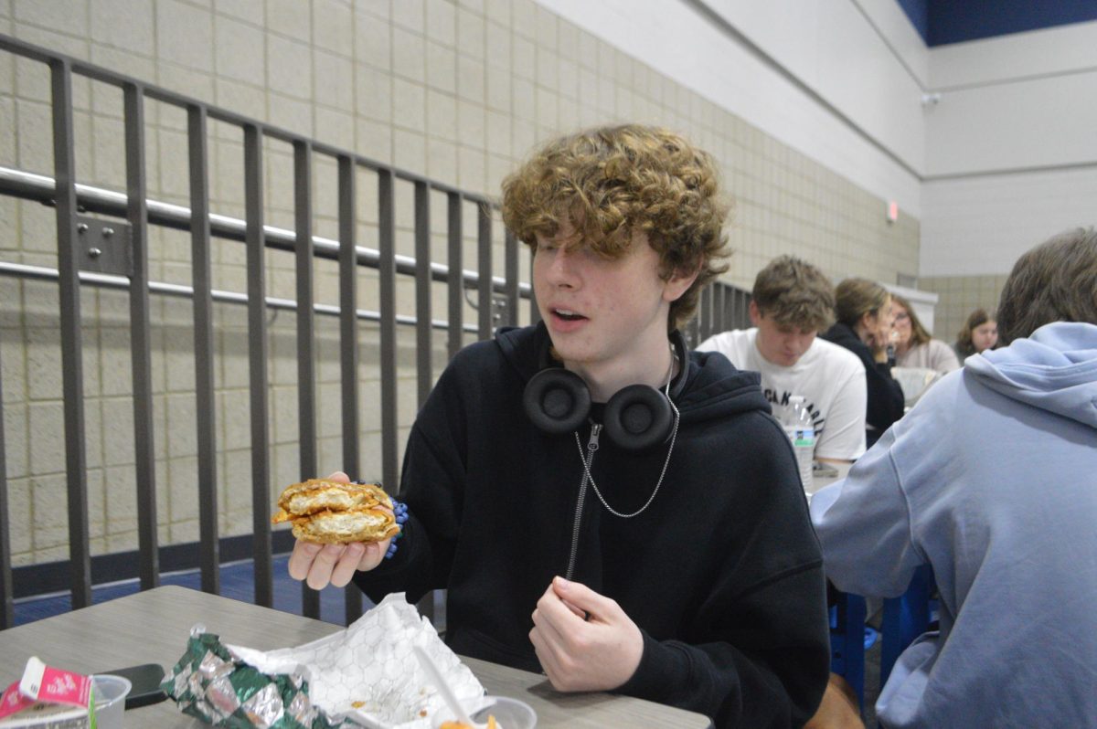 Junior Jace Merritt shows off his "Double-Decker Chicken Sandwich" during lunch on Sept. 15. 