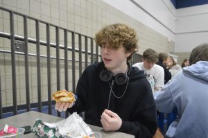 Junior Jace Merritt shows off his "Double-Decker Chicken Sandwich" during lunch on Sept. 15. 