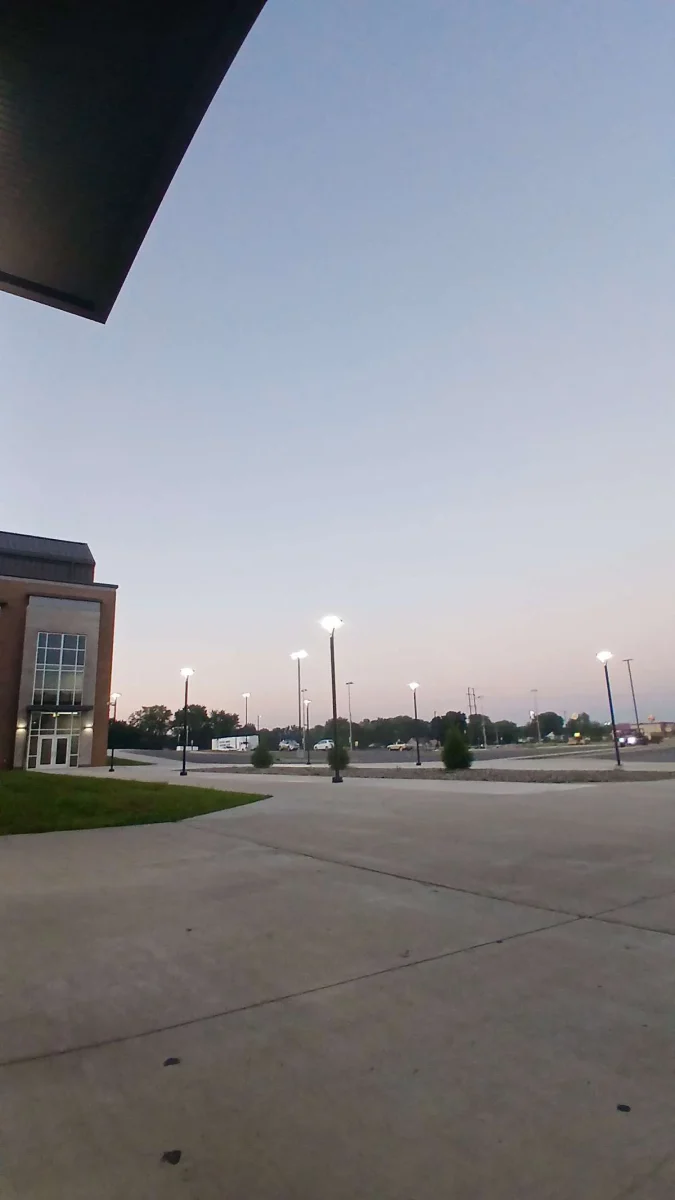 Students who arrive before 7:45 a.m. get clear morning sky, birds flying over head before the school doors open.