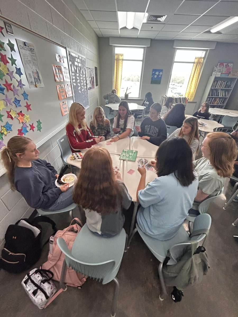 A group of students play a game of cards in Ms. Sherrard’s room during PowerHour, September of 2024. Students use PowerHour as a break from their stressful day as they have fun and socialize with one another.
