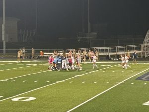 REGION CHAMPS! Girls' soccer team rallies on the field in celebration after beating the ranked Elizabethtown team 1-0 on Oct. 15. This is the sixth contest win in a row for the girls soccer team. 